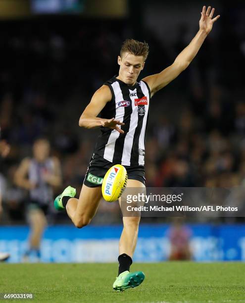 Darcy Moore of the Magpies kicks the ball during the 2017 AFL round 04 match between the Collingwood Magpies and the St Kilda Saints at Etihad...