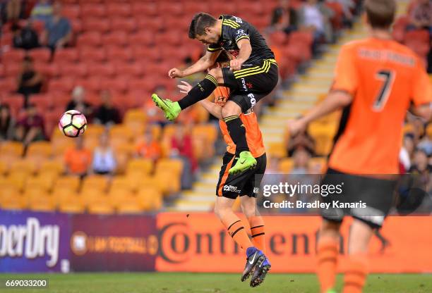 Kosta Barbarouses of the Phoenix strikes the ball during the round 27 A-League match between the Brisbane Roar and the Wellington Phoenix at Suncorp...