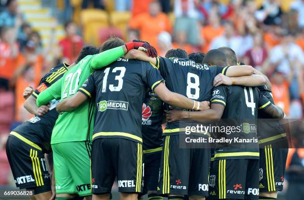 Phoenix players embrace before the round 27 A-League match between the Brisbane Roar and the Wellington Phoenix at Suncorp Stadium on April 16, 2017...