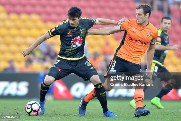 Guilherme Finkler of the Phoenix and Luke DeVere of the Roar during the round 27 A-League match between the Brisbane Roar and the Wellington Phoenix...