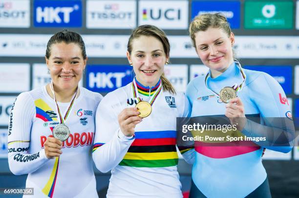 Kristina Vogel of Germany celebrates winning in the Women's Keirin's prize ceremony with Martha Bayona Pineda of Colombia and Nicky Degrendele of...