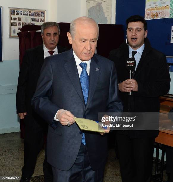 Nationalist Movement Party leader Devlet Bahceli casts his ballots at a polling station during a referendum in Ankara, April 16, 2017 Turkey....