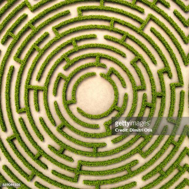 aerial view of round hedge maze with route to centre - geometric maze stock pictures, royalty-free photos & images