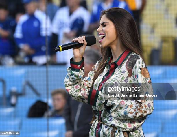 Antonella Barba sings the National Anthem before the game between the Los Angeles Dodgers and the Arizona Diamondbacks at Dodger Stadium on April 14,...