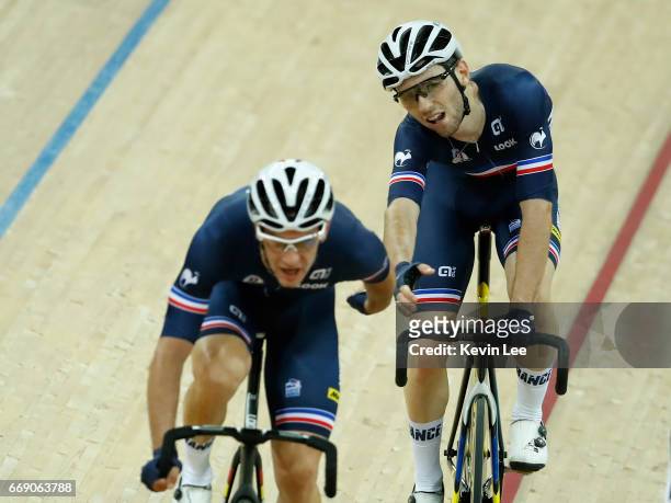 Morgan Kneisky swing Benjamin Thomas of France forward in relay of the Men's Madison Final on Day 5 in 2017 UCI Track Cycling World Championships at...