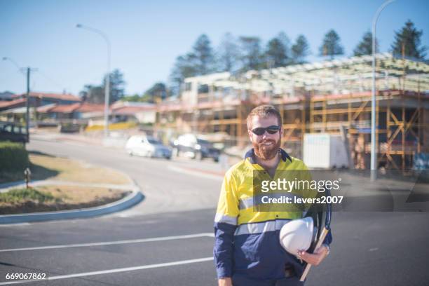 professional site manager working outdoors - tradesman portrait stock pictures, royalty-free photos & images