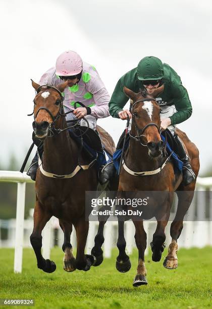 Meath , Ireland - 16 April 2017; Augusta Kate, right, with David Mullins up, races Let's Dance, with Ruby Walsh up, to the line on their way to...