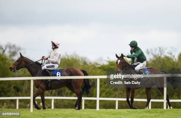 Meath , Ireland - 16 April 2017; David Mullins, right, congratulates his horse Augusta Kate, after beating Let's Dance, left, with Ruby Walsh up, to...