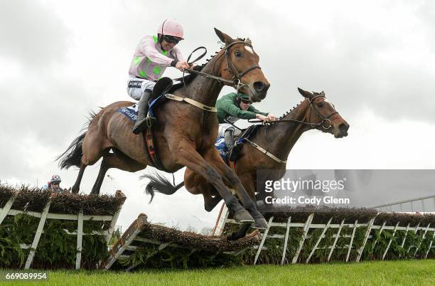Meath , Ireland - 16 April 2017; Augusta Kate, right, with David Mullins up, jump the last alongside Let's Dance, with Ruby Walsh up, who finished...