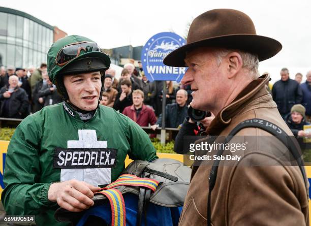Meath , Ireland - 16 April 2017; Jockey David Mullins, left, and trainer Willie Mullins, right, after winning the Irish Stallion Farms European...