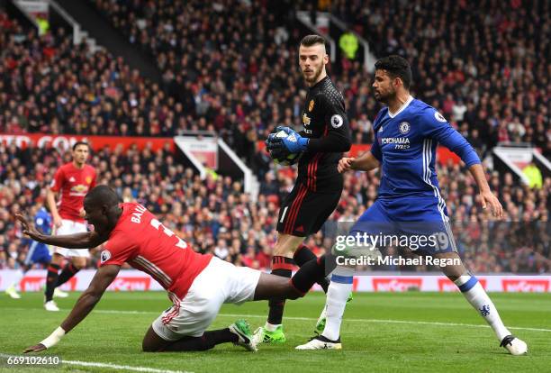 Eric Bailly of Manchester United is fouled by Diego Costa of Chelsea as David De Gea of Manchester United collects the ball during the Premier League...