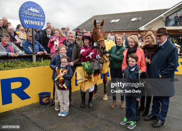 Meath , Ireland - 16 April 2017; Jockey Bryan Cooper and Road To Respect with the winning connections including owner Michael O'Leary following the...