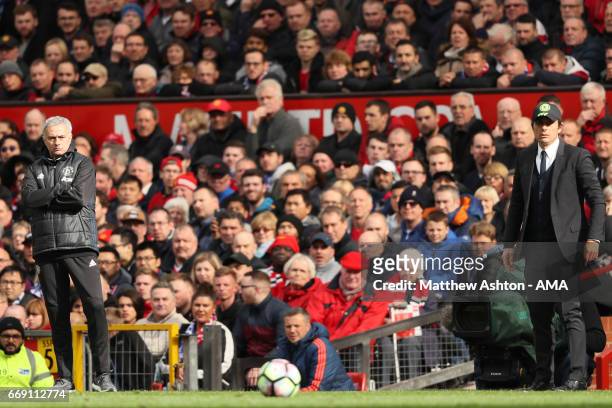 Chelsea Head Coach / Manager Antonio Conte and Manchester United Head Coach / Manager Jose Mourinho look on during the Premier League match between...