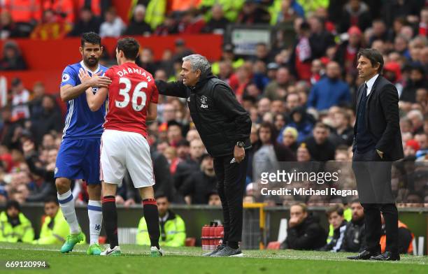 Diego Costa of Chelsea and Matteo Darmian of Manchester United confront each other during the Premier League match between Manchester United and...