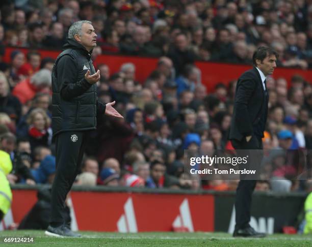 Manager Jose Mourinho of Manchester United and Manager Antonio Conte of Chelsea watch from the touchline during the Premier League match between...