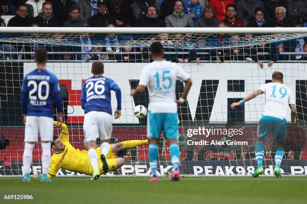 Goalkeeper Michael Esser of Darmstadt saves a penalty from Guido Burgstaller of Schalke during the Bundesliga match between SV Darmstadt 98 and FC...