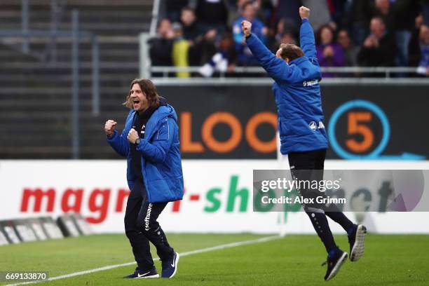 Head coach Torsten Frings and assistant coach Bjoern Mueller of Darmstadt celebrate the last minute winning goal during the Bundesliga match between...