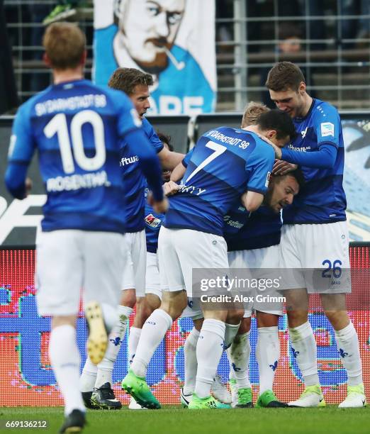 Jerome Gondorf of Darmstadt celebrates his team's second goal with team mates during the Bundesliga match between SV Darmstadt 98 and FC Schalke 04...