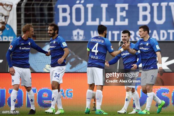 Jerome Gondorf of Darmstadt celebrates his team's second goal with team mates during the Bundesliga match between SV Darmstadt 98 and FC Schalke 04...