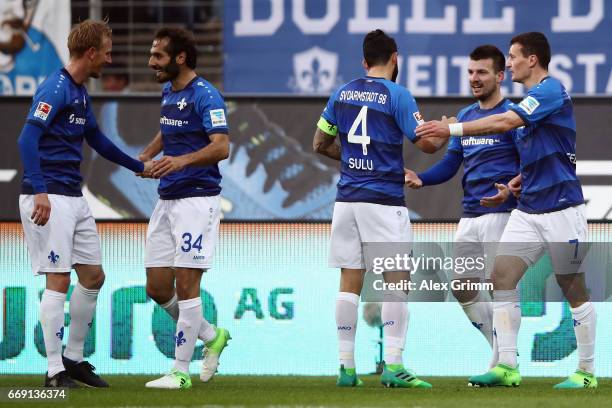 Jerome Gondorf of Darmstadt celebrates his team's second goal with team mates during the Bundesliga match between SV Darmstadt 98 and FC Schalke 04...