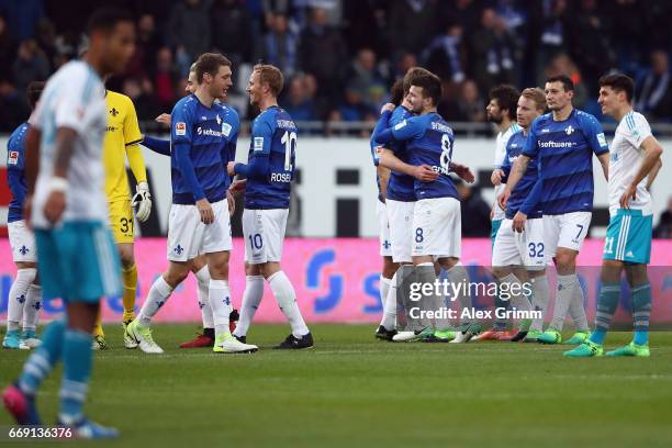 Players of Darmstadt celebrate after the Bundesliga match between SV Darmstadt 98 and FC Schalke 04 at Stadion am Boellenfalltor on April 16, 2017 in...