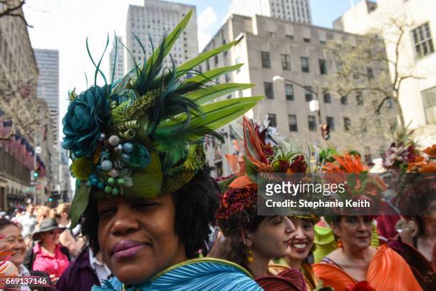 People wear fanciful hats during the Easter Parade and Bonnet Festival along 5th Avenue on April 16, 2017 in New York City. The pageant is an annual...