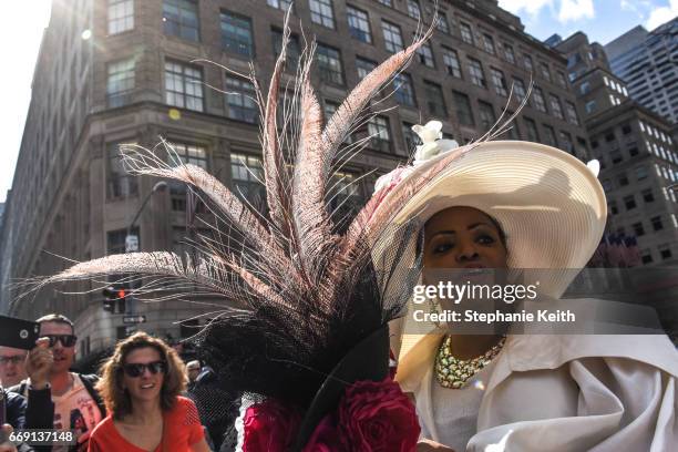 People wear fanciful hats during the Easter Parade and Bonnet Festival along 5th Avenue on April 16, 2017 in New York City. The pageant is an annual...