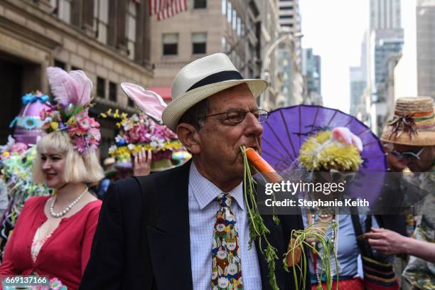 People wear fanciful hats during the Easter Parade and Bonnet Festival along 5th Avenue on April 16, 2017 in New York City. The pageant is an annual...