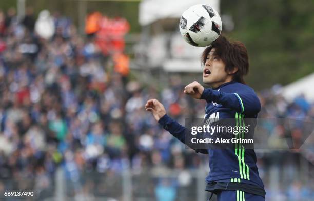 Atsuto Uchida of Schalke warms up prior to the Bundesliga match between SV Darmstadt 98 and FC Schalke 04 at Stadion am Boellenfalltor on April 16,...