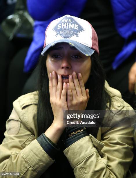 Supporters of People's Republican Party follow early results on TV at CHP's headquarters as vote counting continues following the finish of...