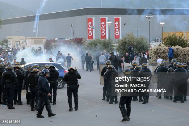 French anti-riot policemen scatter Bastia's supporters outside the stadium after the French L1 football match Bastia vs Lyon on April 16, 2017 in the...
