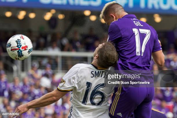 Orlando midfielder Luis Gil and Los Angeles Galaxy defender Nathan Smith during the soccer match between the LA Galaxy and the Orlando City Lions on...