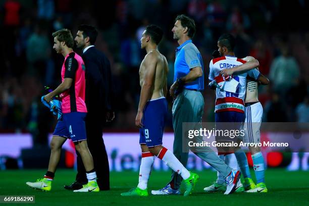 Head coach Tony Adams of Granada CF leaves the pithc with his player Ezequiel Ponce palyers after the La Liga match between Granada CF and Real Club...