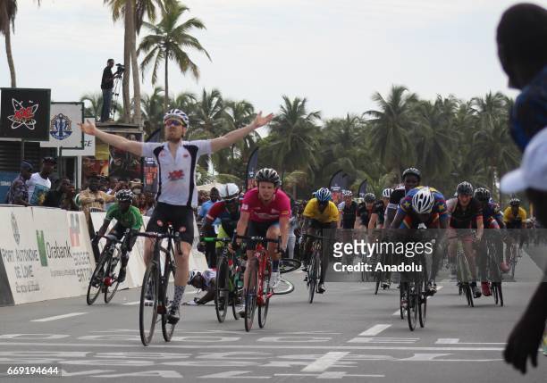 Belgian cyclist Stein Van Coute Cyclists celebrates his victory after the final 80km track, Mono Boulevard, 26th international cycling race of Togo...