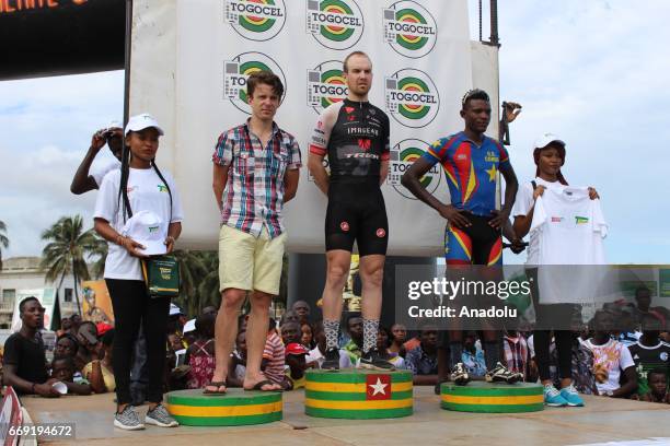 Belgian cyclist Stein Van Coute celebrates his victory after the final 80km track, Mono Boulevard, 26th international cycling race of Togo on April...