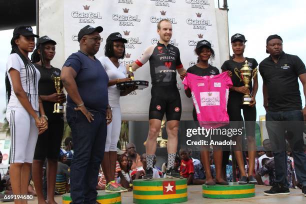 Belgian cyclist Stein Van Coute celebrates his victory after the final 80km track, Mono Boulevard, 26th international cycling race of Togo on April...