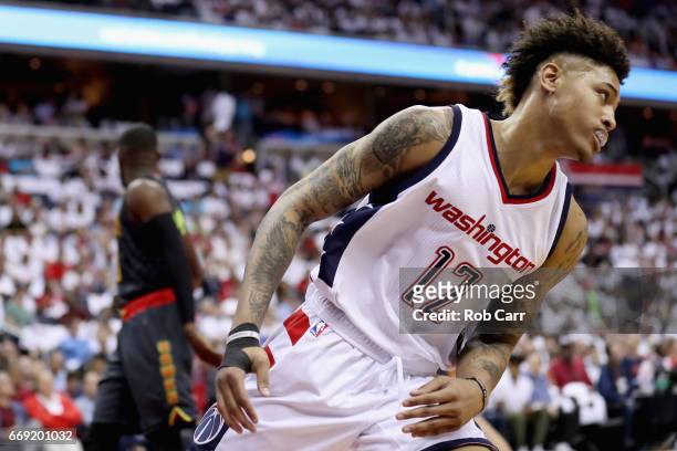 Kelly Oubre Jr. #12 of the Washington Wizards reacts after dunking the ball against the Atlanta Hawks in Game One of the Eastern Conference...