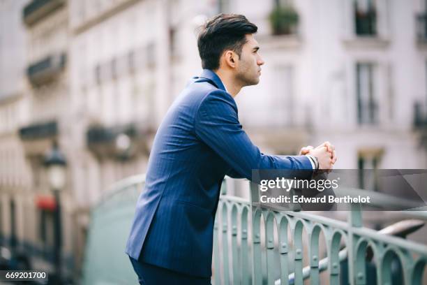 Anil Brancaleoni, Youtube personality and digital influencer WaRTeK, wears a Lanieri blue suit, a Boggi white shirt, Doucal's shoes, and a bracelet...