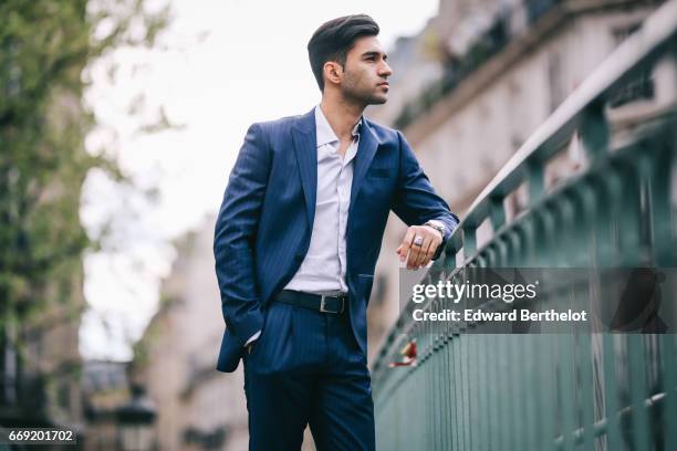 Anil Brancaleoni, Youtube personality and digital influencer WaRTeK, wears a Lanieri blue suit, a Boggi white shirt, Doucal's shoes, and a bracelet...