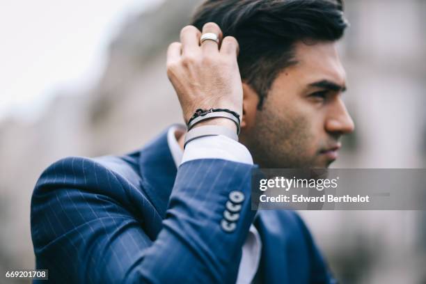 Anil Brancaleoni, Youtube personality and digital influencer WaRTeK, wears a Lanieri blue suit, a Boggi white shirt, Doucal's shoes, and a bracelet...