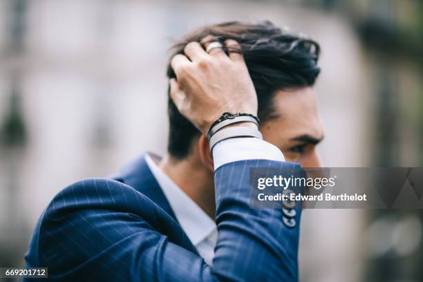 Anil Brancaleoni, Youtube personality and digital influencer WaRTeK, wears a Lanieri blue suit, a Boggi white shirt, Doucal's shoes, and a bracelet...