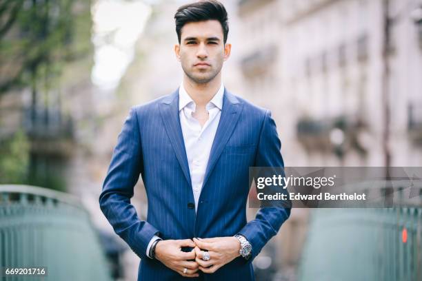 Anil Brancaleoni, Youtube personality and digital influencer WaRTeK, wears a Lanieri blue suit, a Boggi white shirt, Doucal's shoes, and a bracelet...