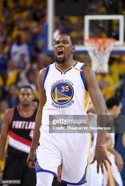 Kevin Durant of the Golden State Warriors reacts after they make a defensive stop against the Portland Trail Blazers in the fourth quarter during...