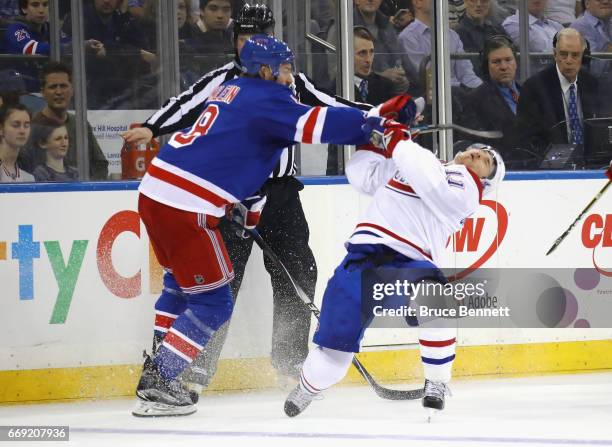 Kevin Klein of the New York Rangers hits Brendan Gallagher of the Montreal Canadiens during the first period in Game Three of the Eastern Conference...