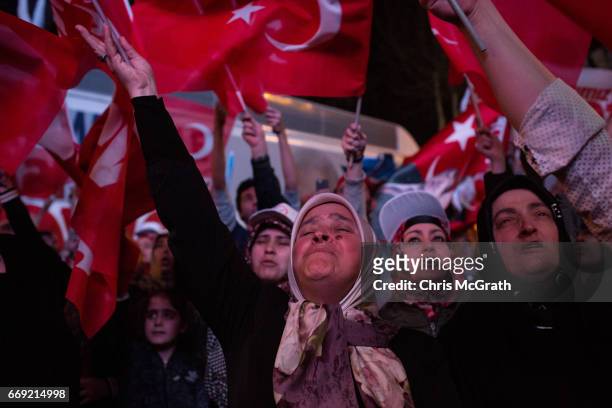People celebrate the 'Evet' vote result outside AK Party headquarters on April 16, 2017 in Istanbul, Turkey. According to unofficial results 51.21%...