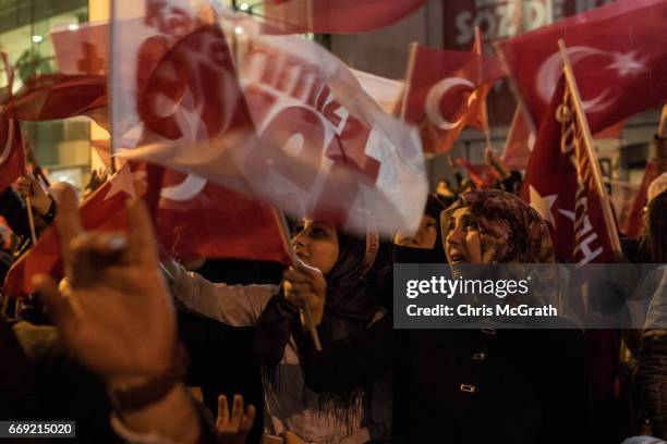 People celebrate the 'Evet' vote result outside AK Party headquarters on April 16, 2017 in Istanbul, Turkey. According to unofficial results 51.21%...