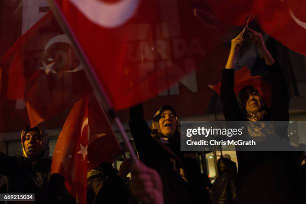 People celebrate the 'Evet' vote result outside AK Party headquarters on April 16, 2017 in Istanbul, Turkey. According to unofficial results 51.21%...