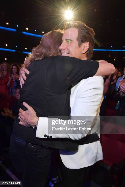 Honoree Barry Gibb of the Bee Gees and actor John Travolta attend "Stayin' Alive: A GRAMMY Salute To The Music Of The Bee Gees" on February 14, 2017...