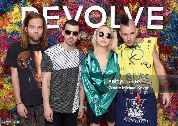 Musicians Jack Lawless, Joe Jonas, JinJoo Lee, and Cole Whittle of DNCE attend the #REVOLVEfestival at Coachella with Moet & Chandon on April 16,...