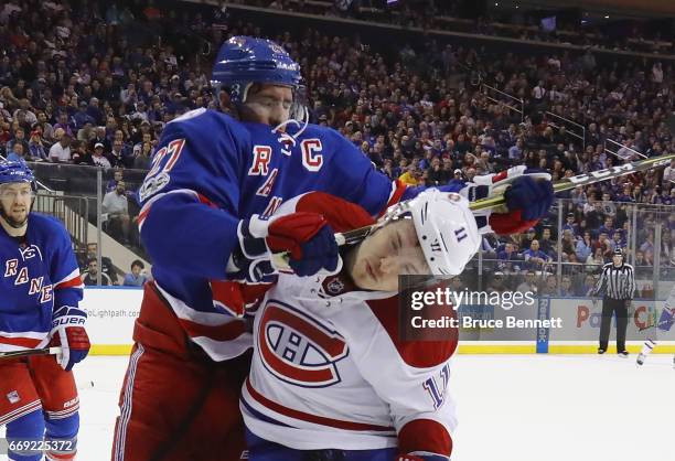 Ryan McDonagh of the New York Rangers gets the stick up on Brendan Gallagher of the Montreal Canadiens during the third period in Game Three of the...